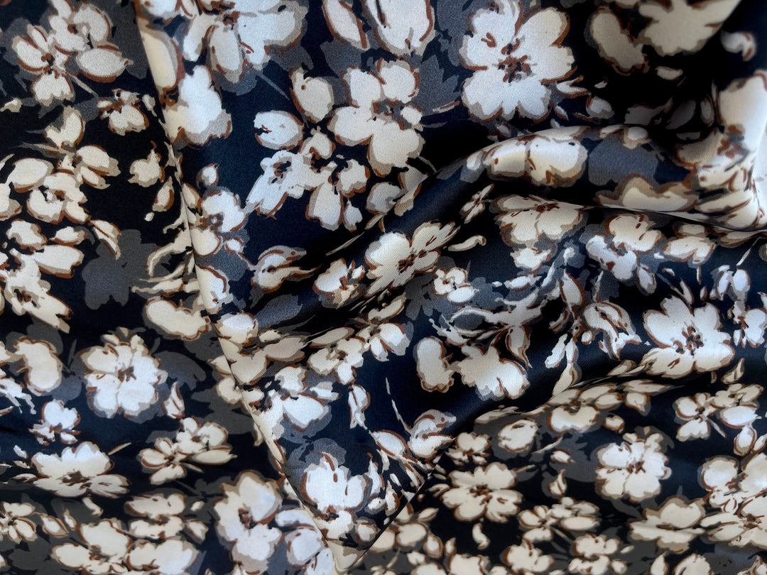 Small white and gray flowers on black satin print floral fabric