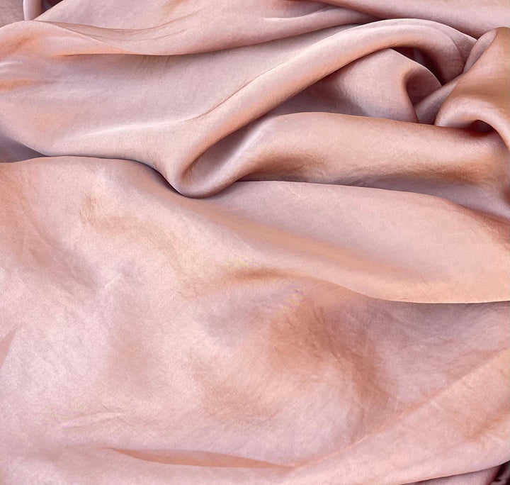 Light peach shiny satin solid fabric