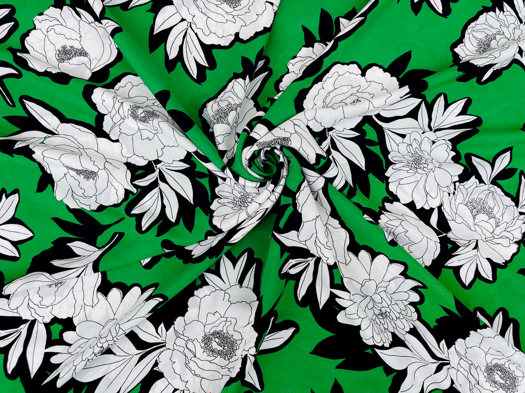 Black and white flowers on emerald green