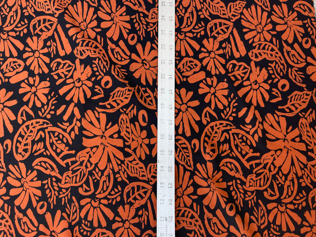 Crepe de Chine fabric by the yard - Orange paisley floral on black