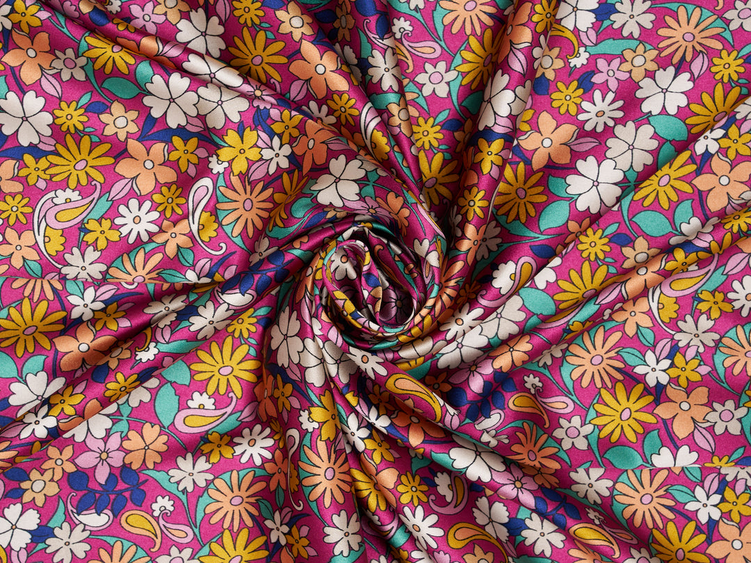 Colorful floral fabric with a pink background