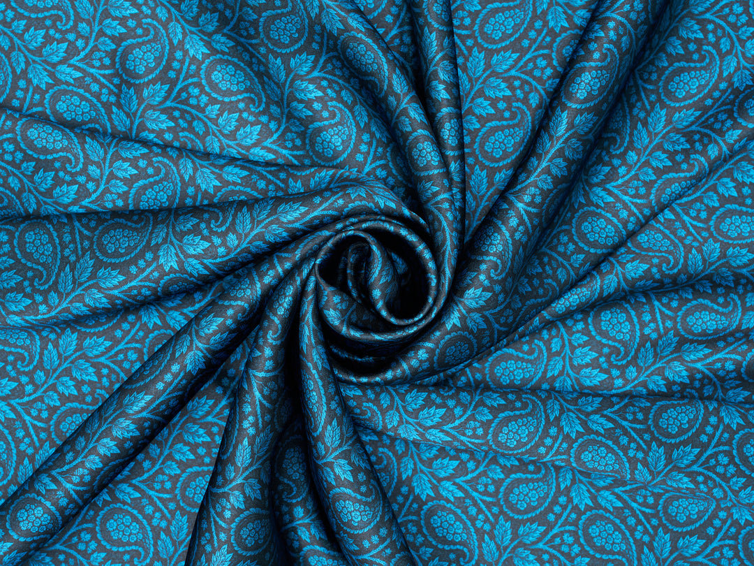 Close-up of blue patterned fabric with a swirl design