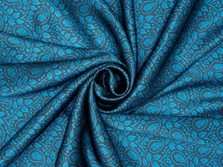 Close-up of blue patterned fabric with a swirl design