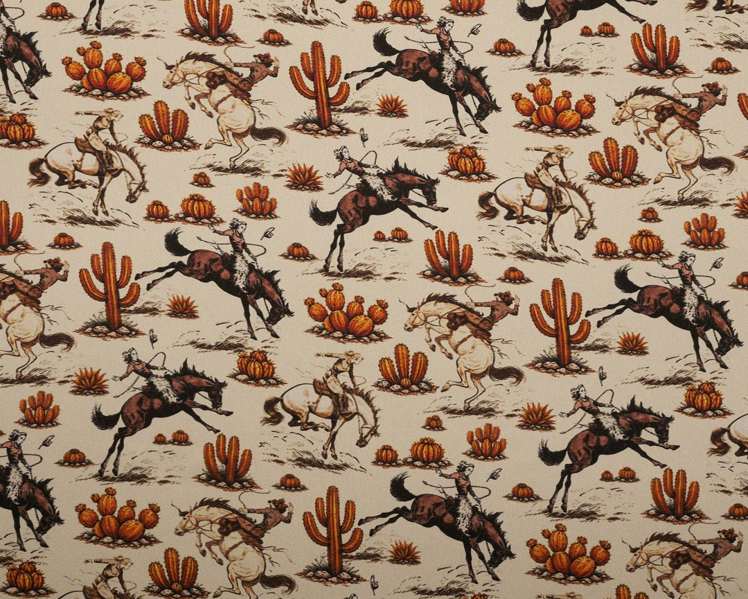 Patterned fabric with horses and cacti on a beige background