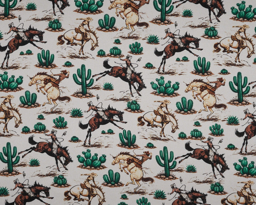 Patterned fabric with horses and cacti on a beige background