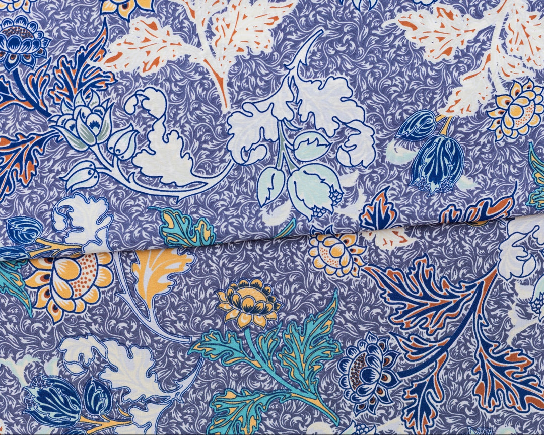 Close-up of a fabric with a floral pattern on a blue background
