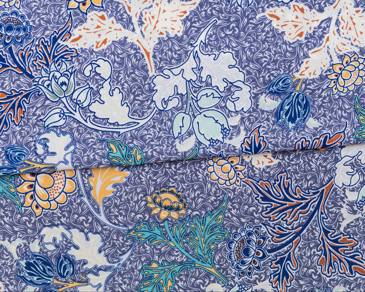 Close-up of a fabric with a floral pattern on a blue background