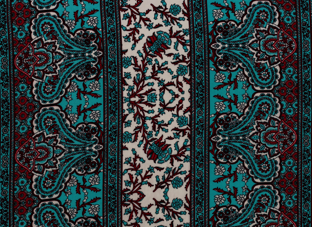 Patterned fabric with turquoise, red, and white colors.