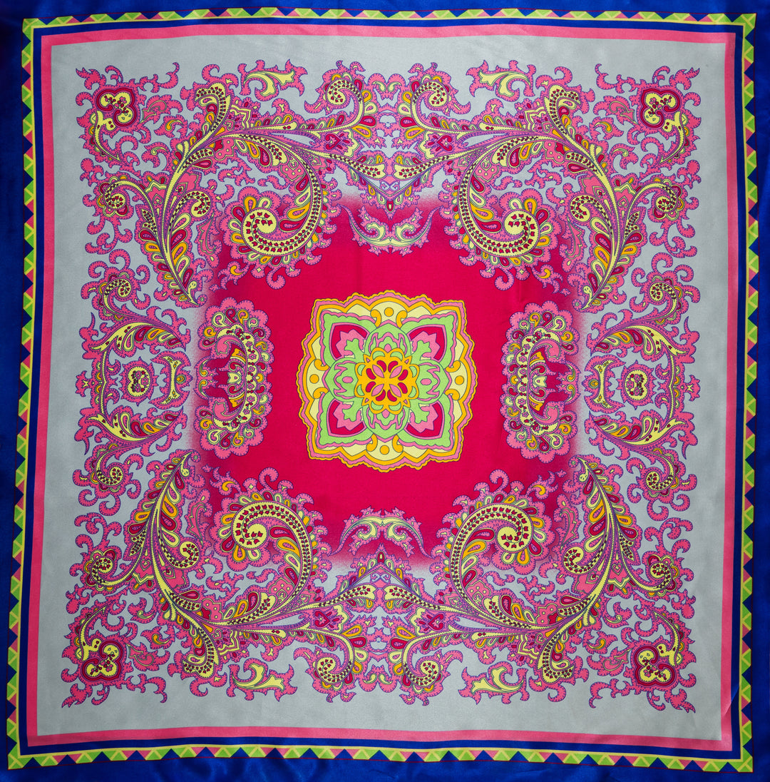 Colorful patterned fabric with a central design on a blue background