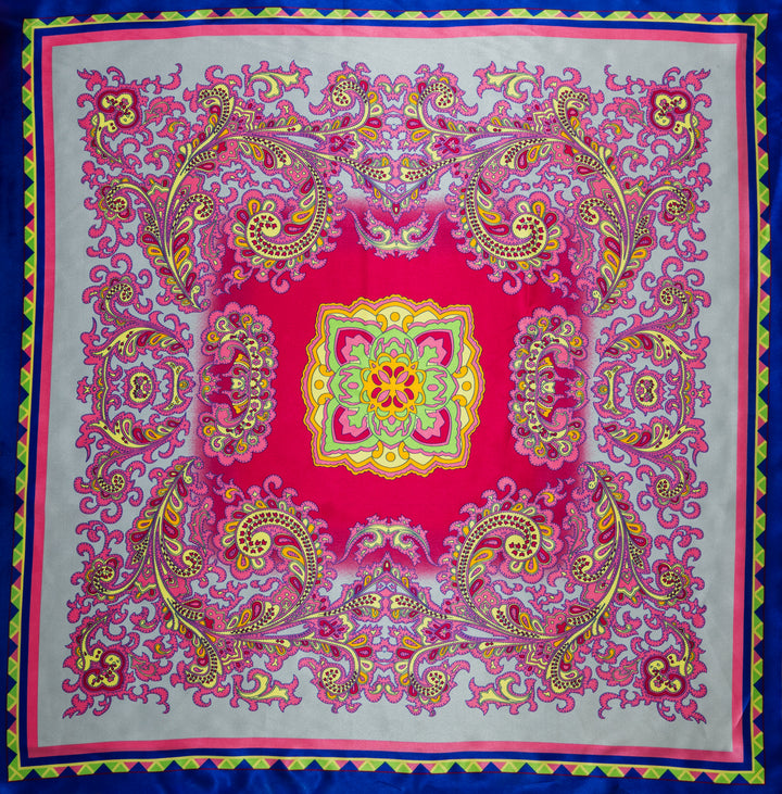 Colorful patterned fabric with a central design on a blue background