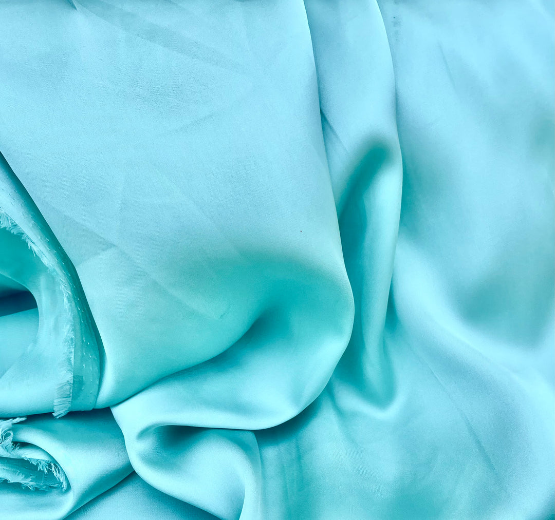 Light teal solid lightweight satin fabric