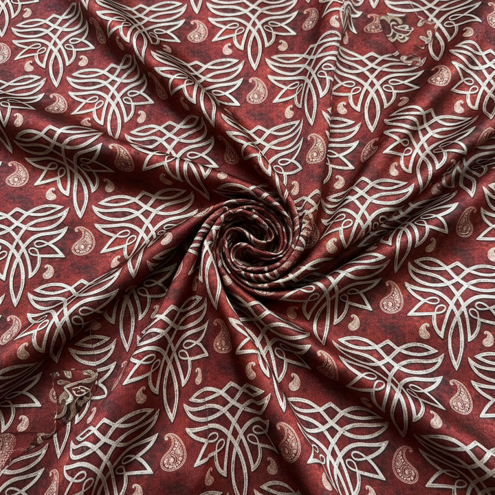 Flat lay overhead swirl of leather boot stitching satin charmeuse fabric
