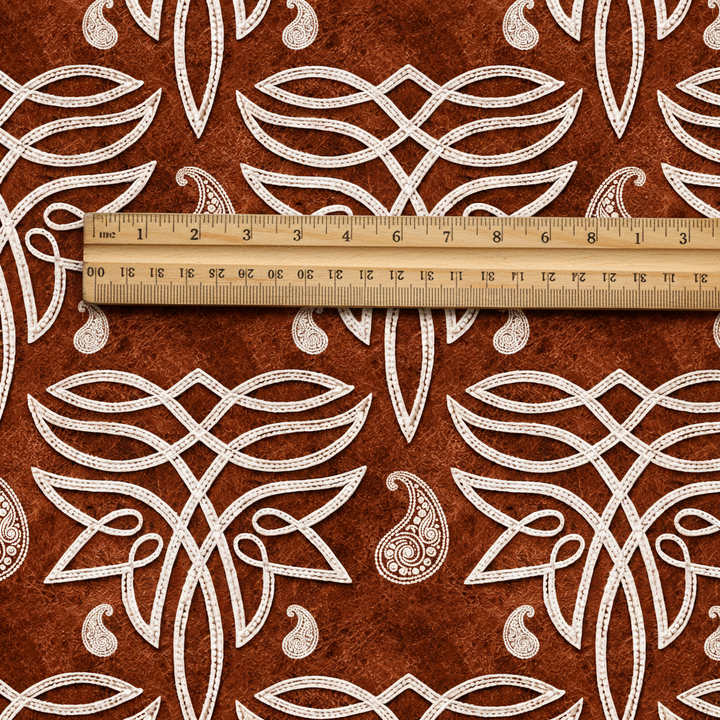 Fabric with wooden ruler showing 3 inch motif scale
