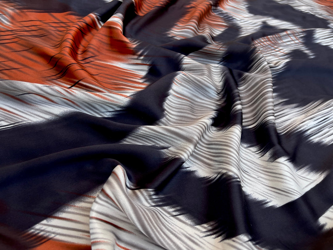 Lightweight  satin fabric by the yard - Ivory black and orange  ikat print