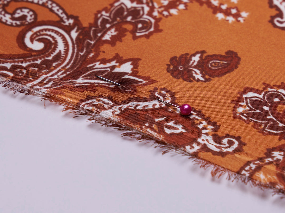 Charmeuse satin fabric by the yard - Burnt Orange distressed paisley   print