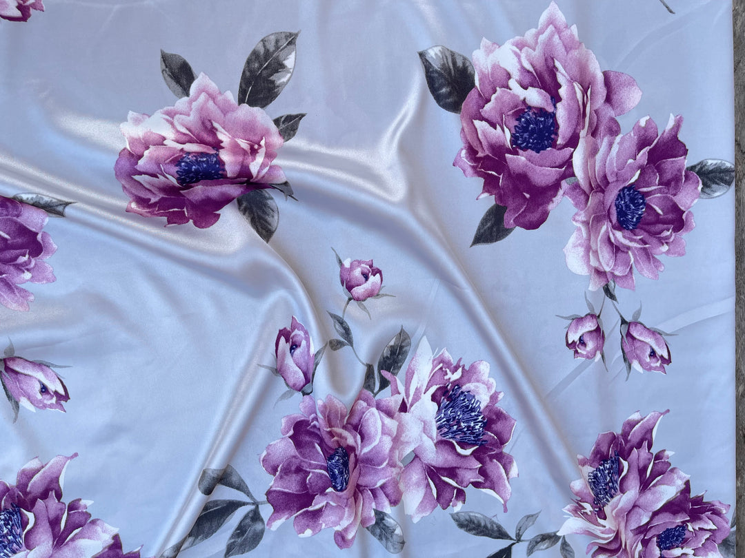 Faux silk charmeuse satin fabric by the yard - light gray with purple flowers  print