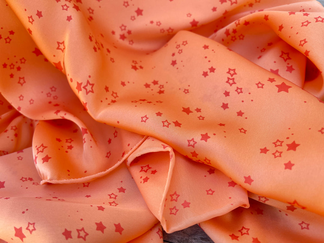 Lightweight  satin  fabric by the yard - Orange Stars  print