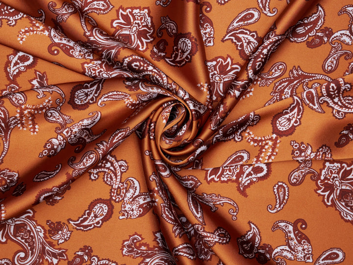 Charmeuse satin fabric by the yard - Burnt Orange distressed paisley   print