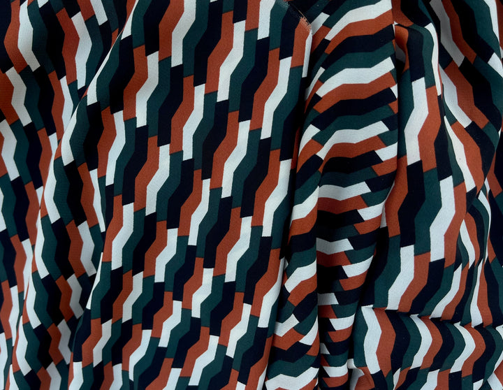 Woolpeach fabric by the yard - Black orange and green pattern