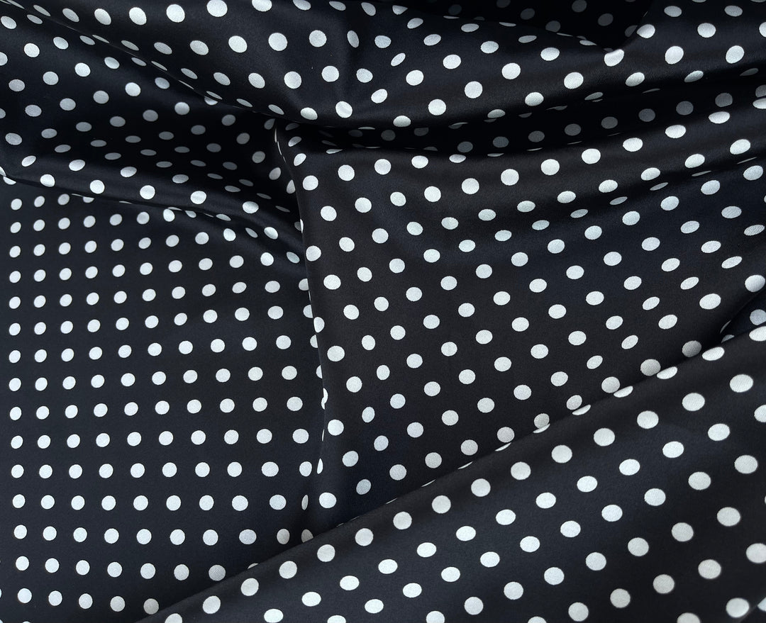 Faux silk charmeus satin fabric by the yard - black polka dots on red