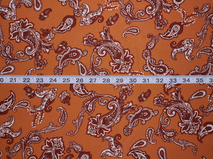 Charmeuse satin fabric by the yard - Burnt Orange distressed paisley   print