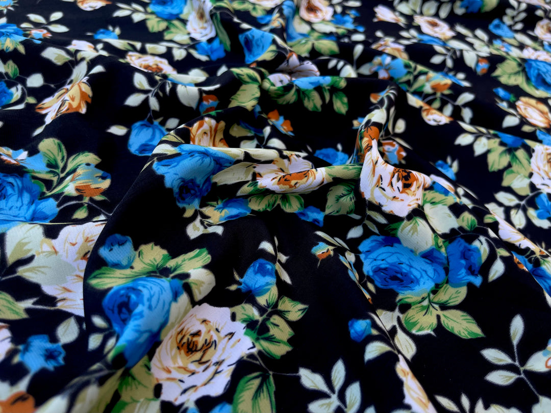 Peachskin  fabric by the yard - Yellow  blue roses on black  print