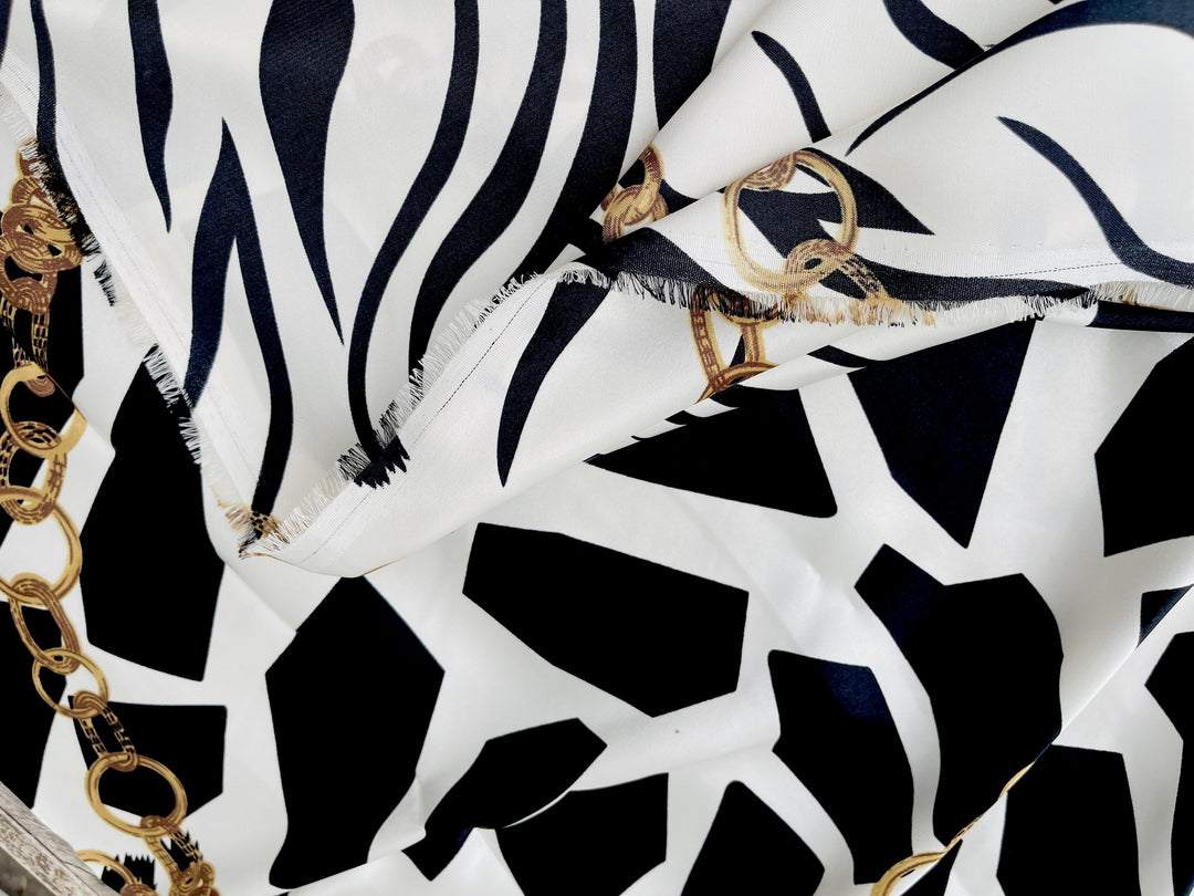 Charmeuse Satin fabric by the yard - Black and white animal with gold chains print