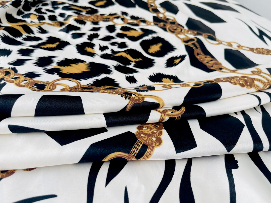 Charmeuse Satin fabric by the yard - Black and white animal with gold chains print