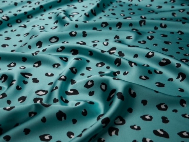 Faux silk cheetah satin fabric by the yard